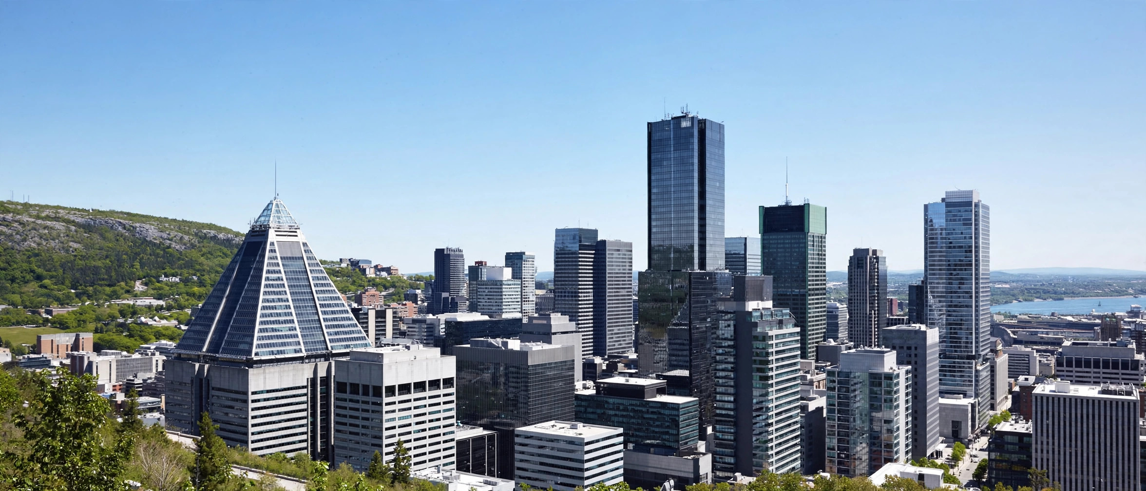 Montreal's downtown skyline in bright daylight, home to one of Canada's largest payment companies.